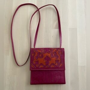 Leaders in leather embossed pink and orange crossbody